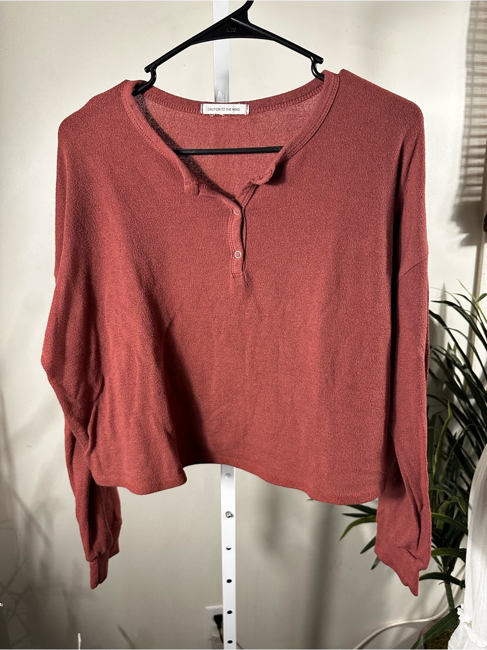 S228. Caution to the Wind Rust Henley Knit Long-Sleeve Top
